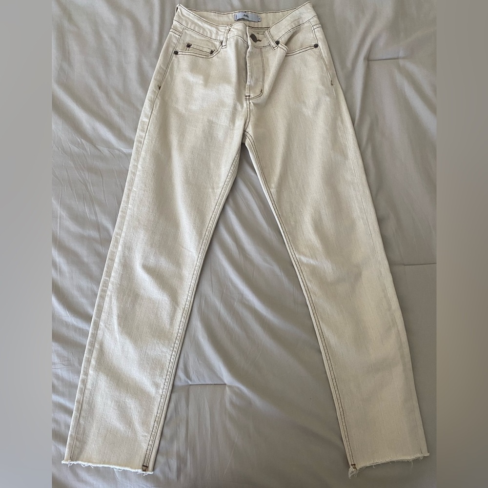Adika Cream Skinny Jeans with brown accents.